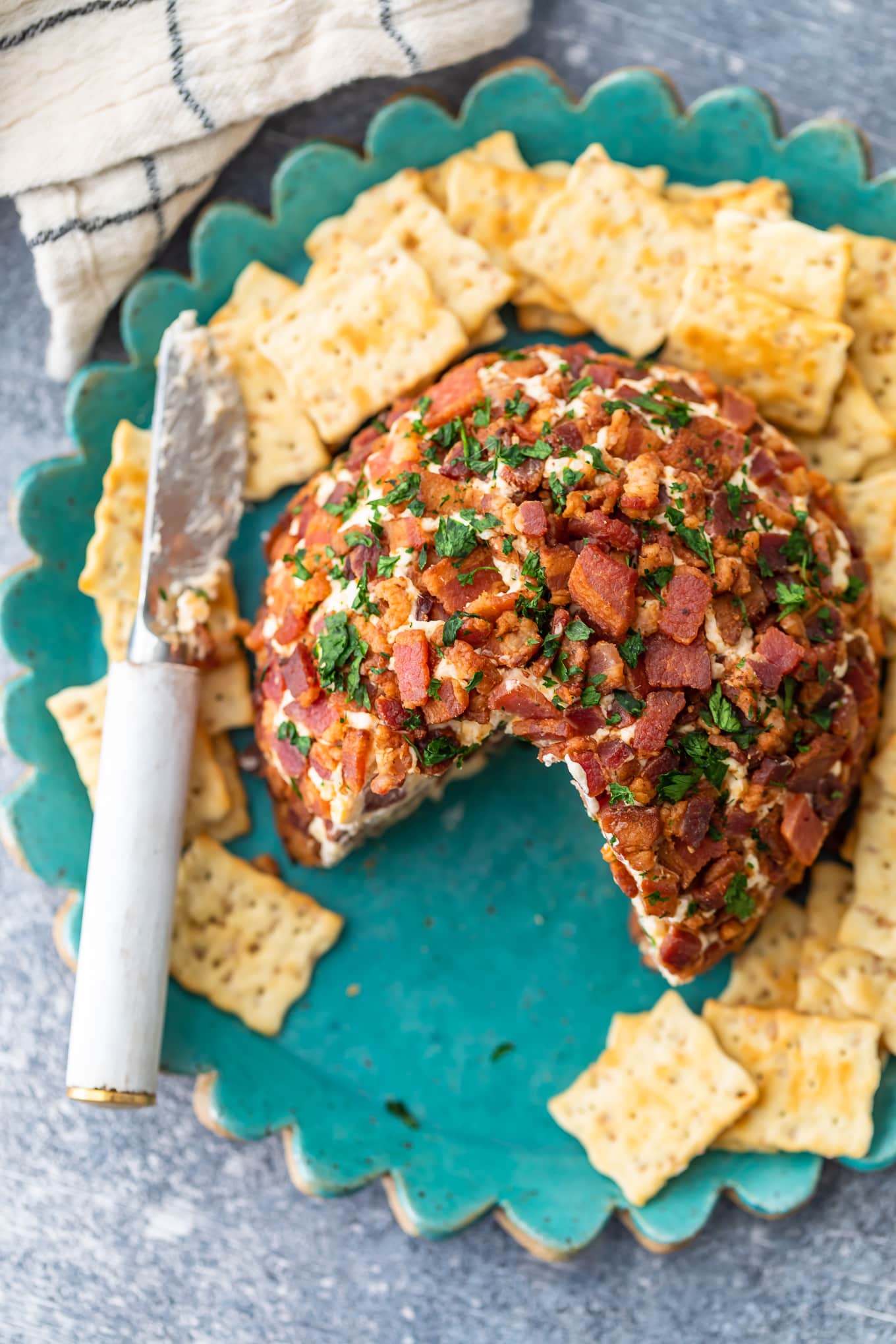 bacon cheese ball recipe on a plate with crackers