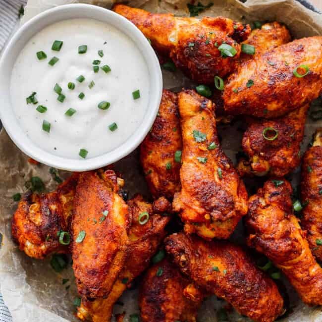 simple spiced baked chicken wings on platter with ranch