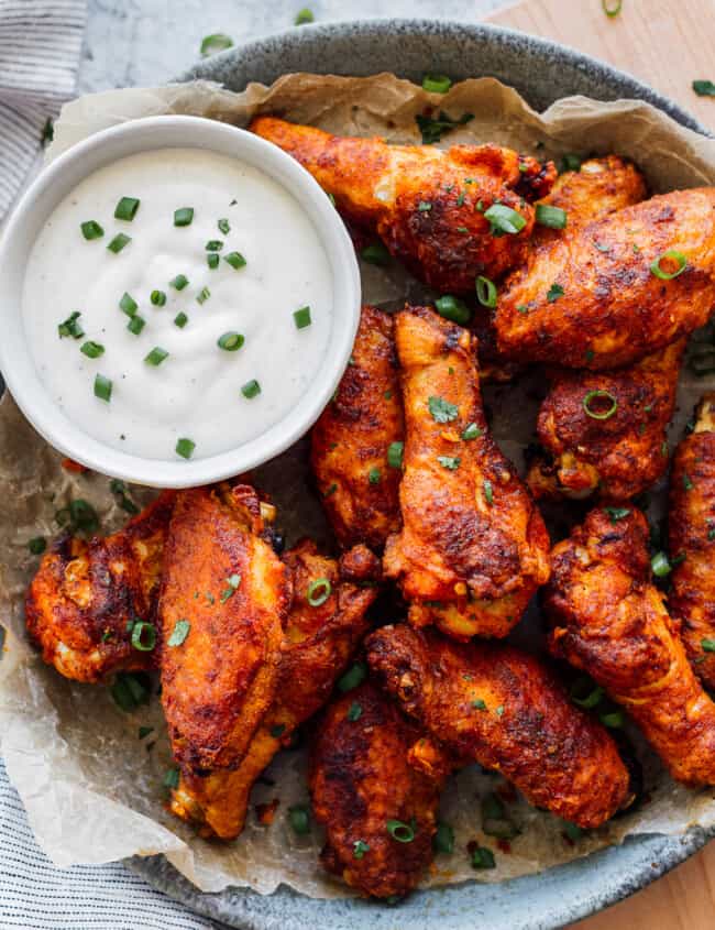 simple spiced baked chicken wings on platter with ranch