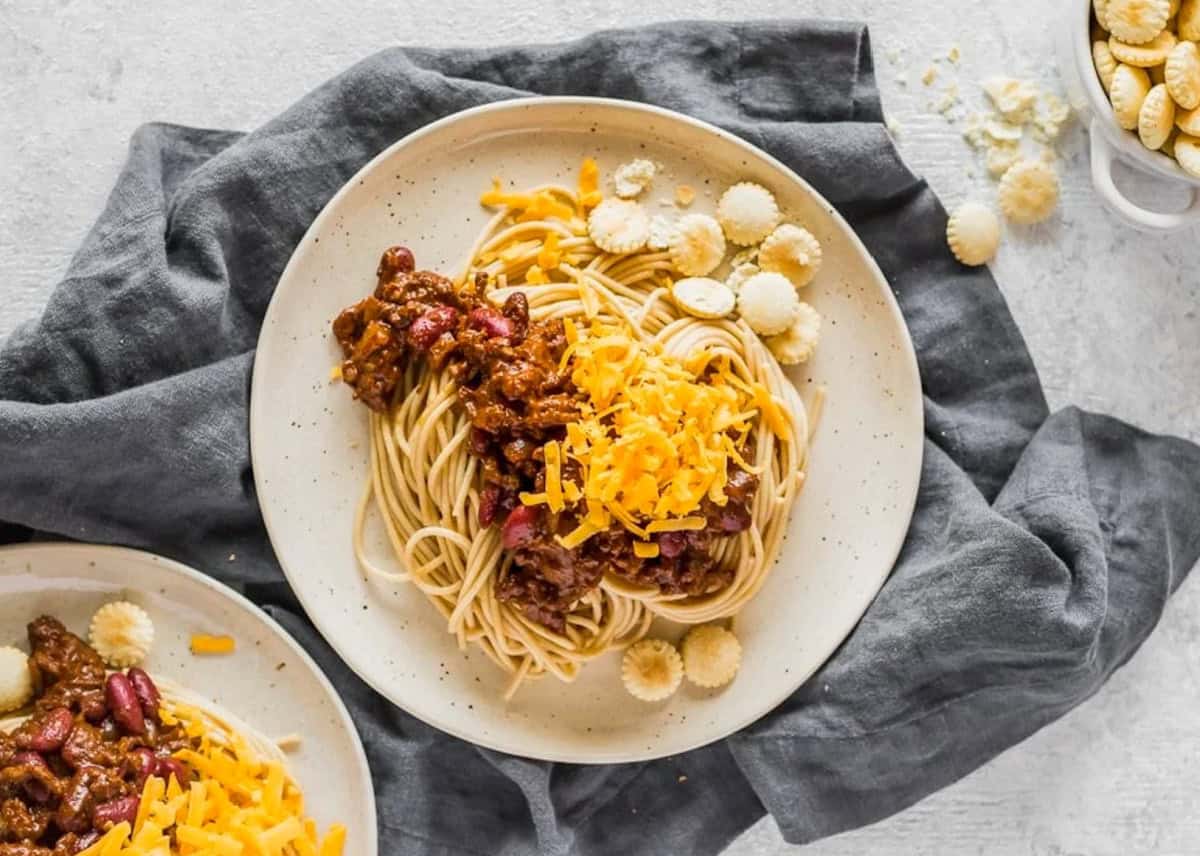 cincinnati chili over spaghetti on plates