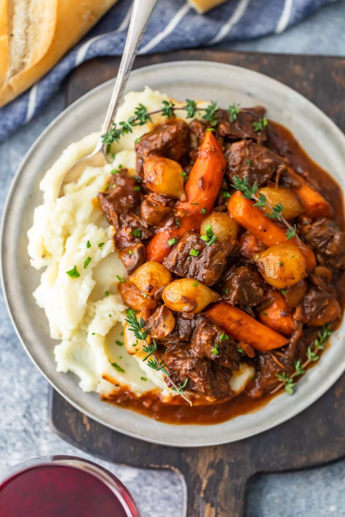 beef burgundy recipe on a plate with mashed potatoes