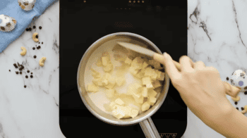 milk, butter, and sugar in a saucepan with a rubber spatula.