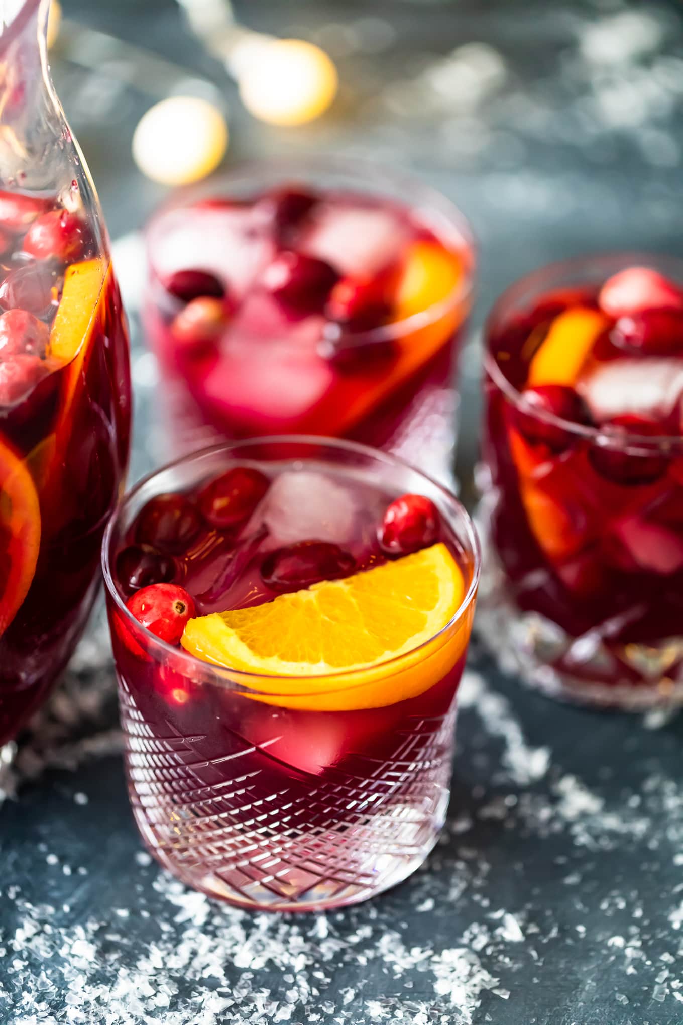 three glasses of orange cranberry sangria