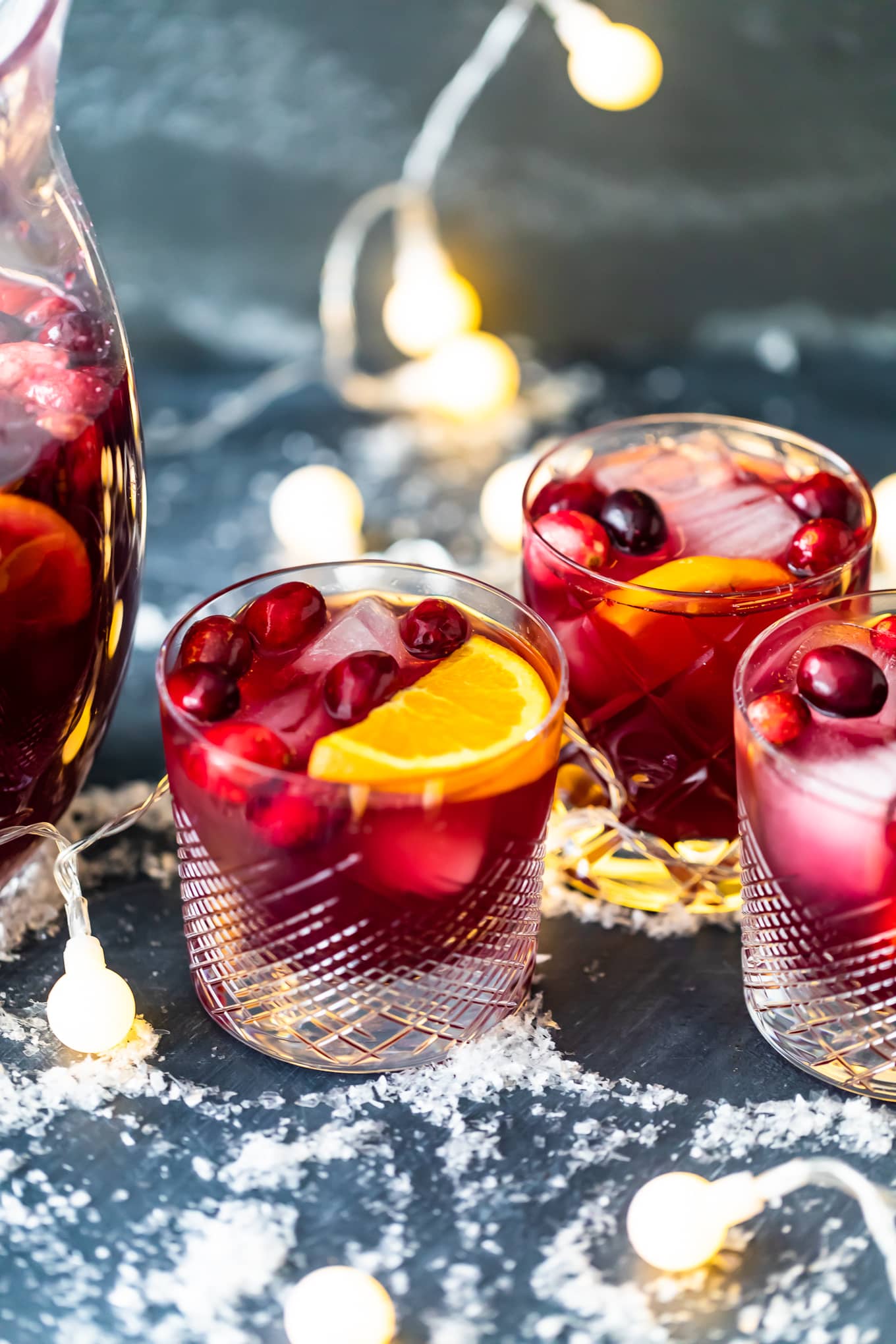 short glasses filled with orange cranberry sangria