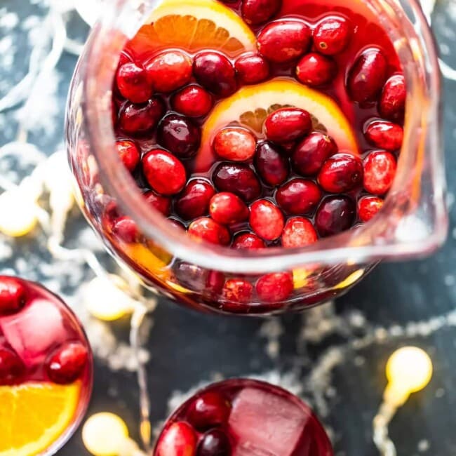 Orange Cranberry Sangria is fresh, fun, and festive. This Christmas Sangria recipe is just perfect for the holiday season!