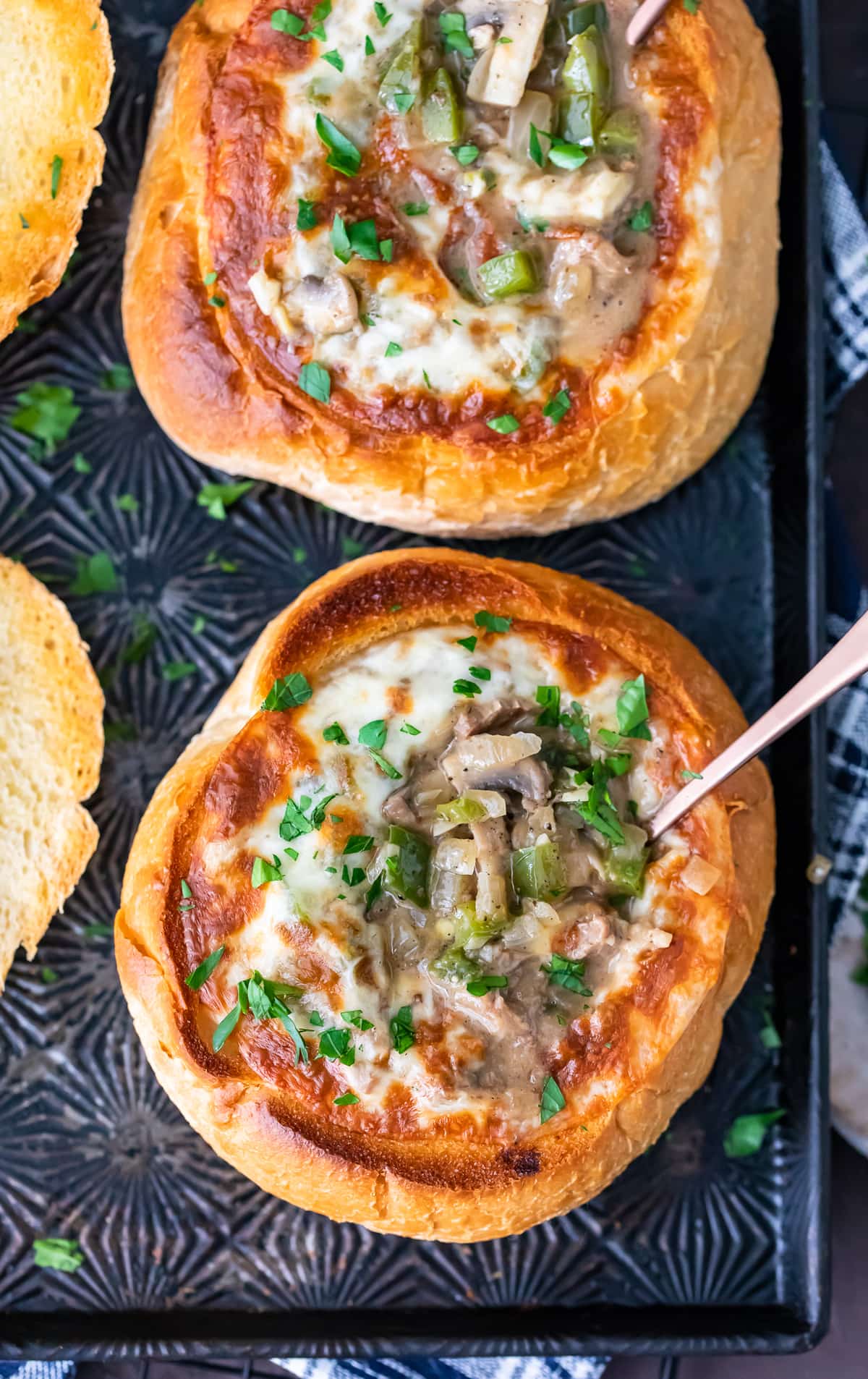 overhead view of philly cheese steak soup bread bowls