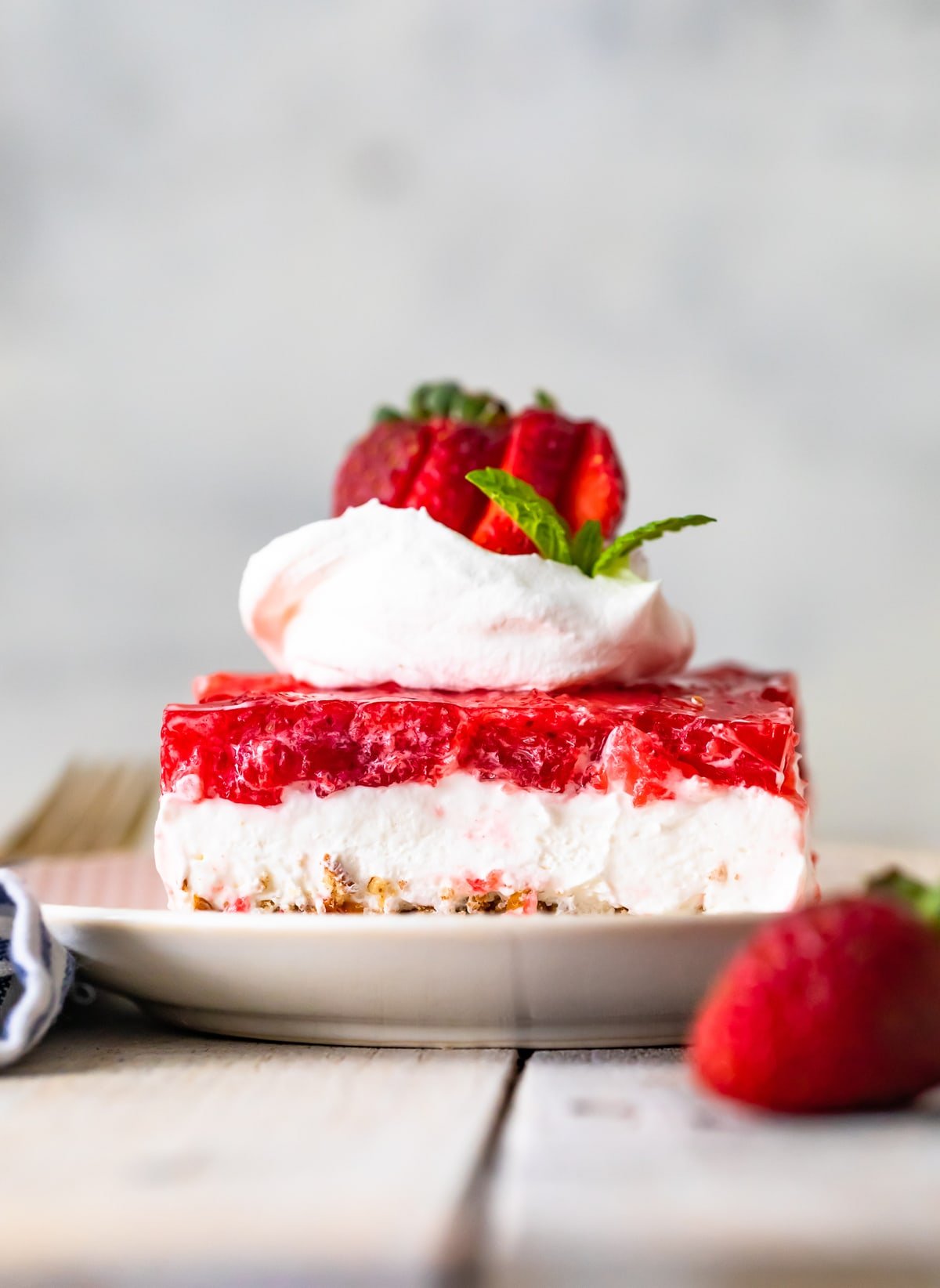 Strawberry Pretzel Salad on a plate on a table