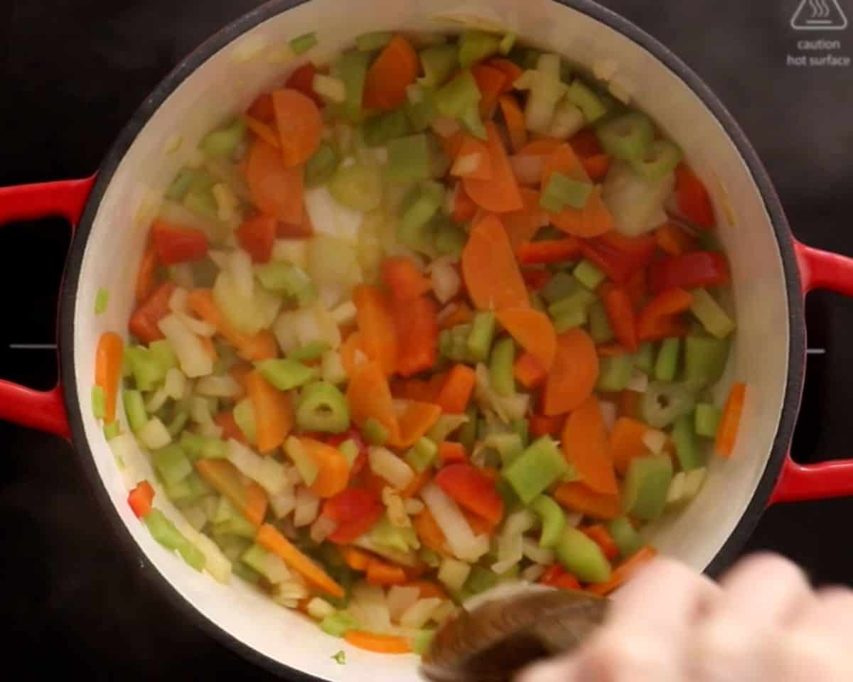carrots, celery, and onion simmered together in a pot