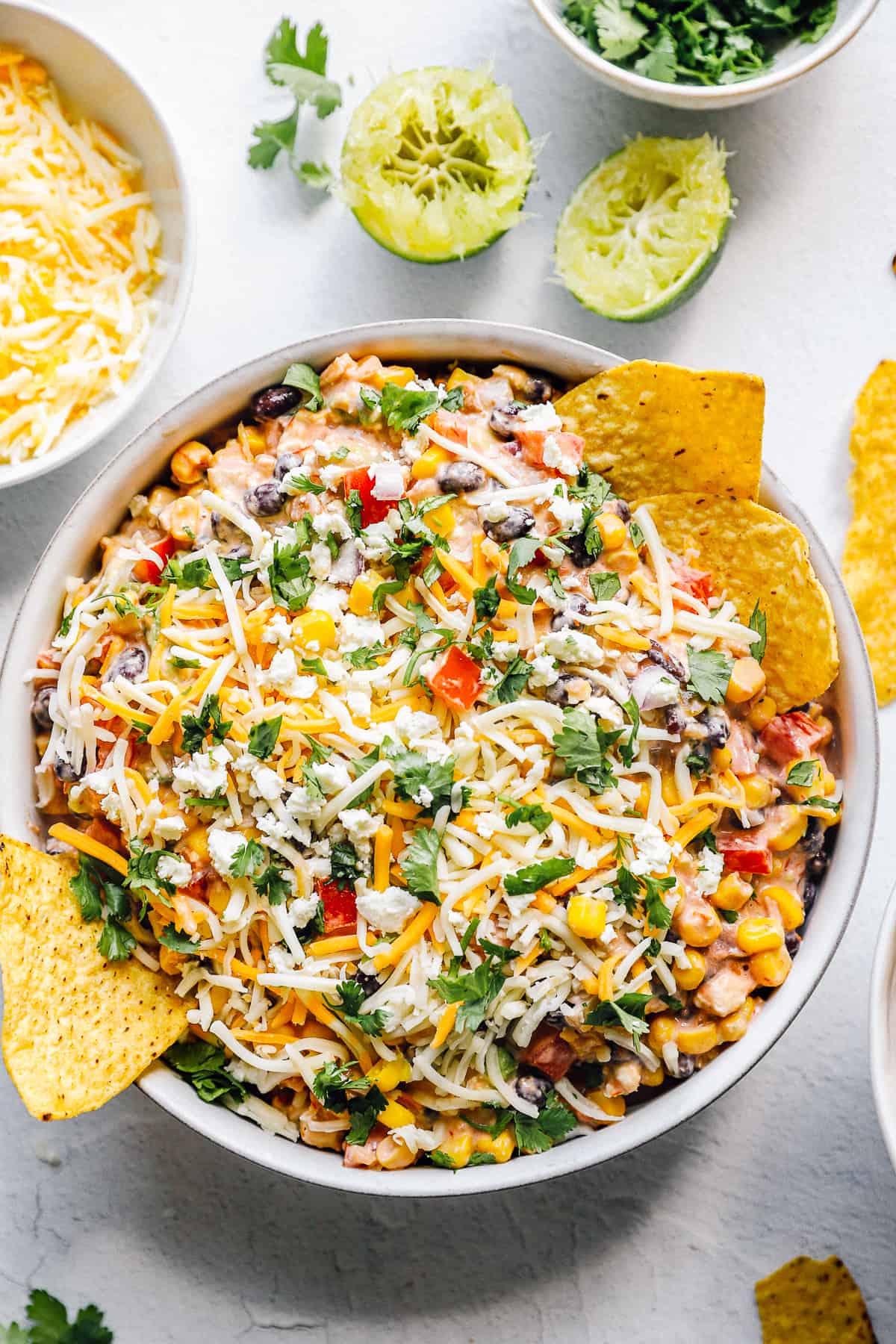 Mexican dip recipe in a bowl with chips.