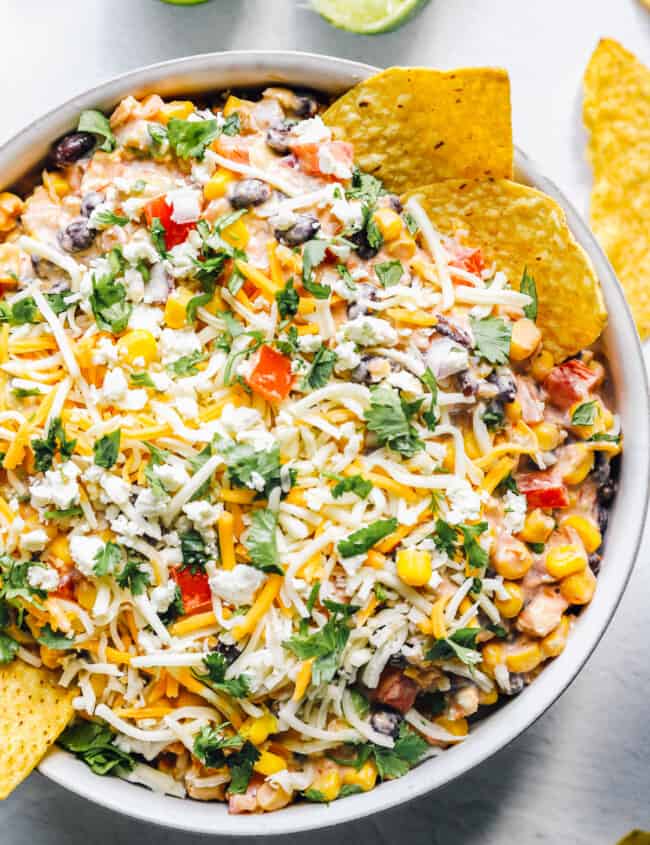 fiesta dip, Mexican dip recipe in a bowl with chips