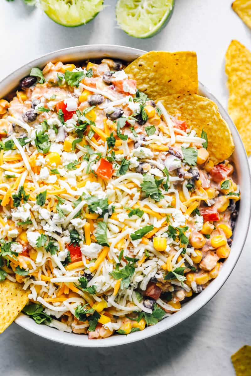 fiesta dip, Mexican dip recipe in a bowl with chips