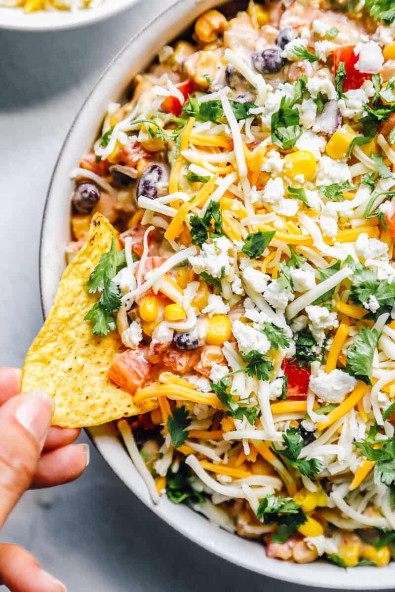 fiesta dip, Mexican dip recipe in a bowl with chips