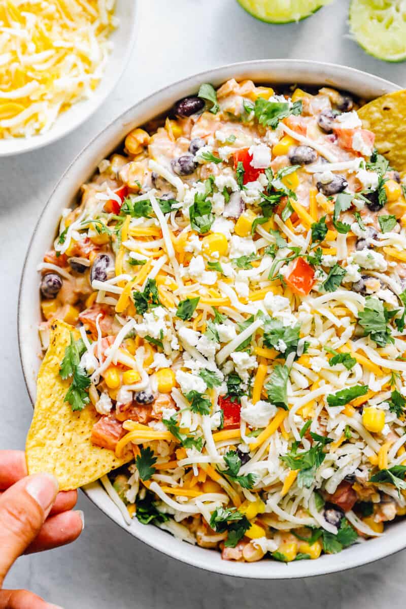 fiesta dip, Mexican dip recipe in a bowl with chips