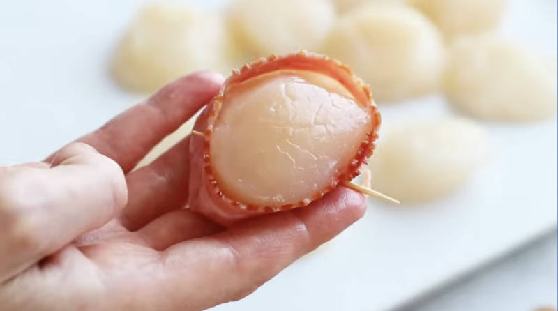 a scallop wrapped in bacon.