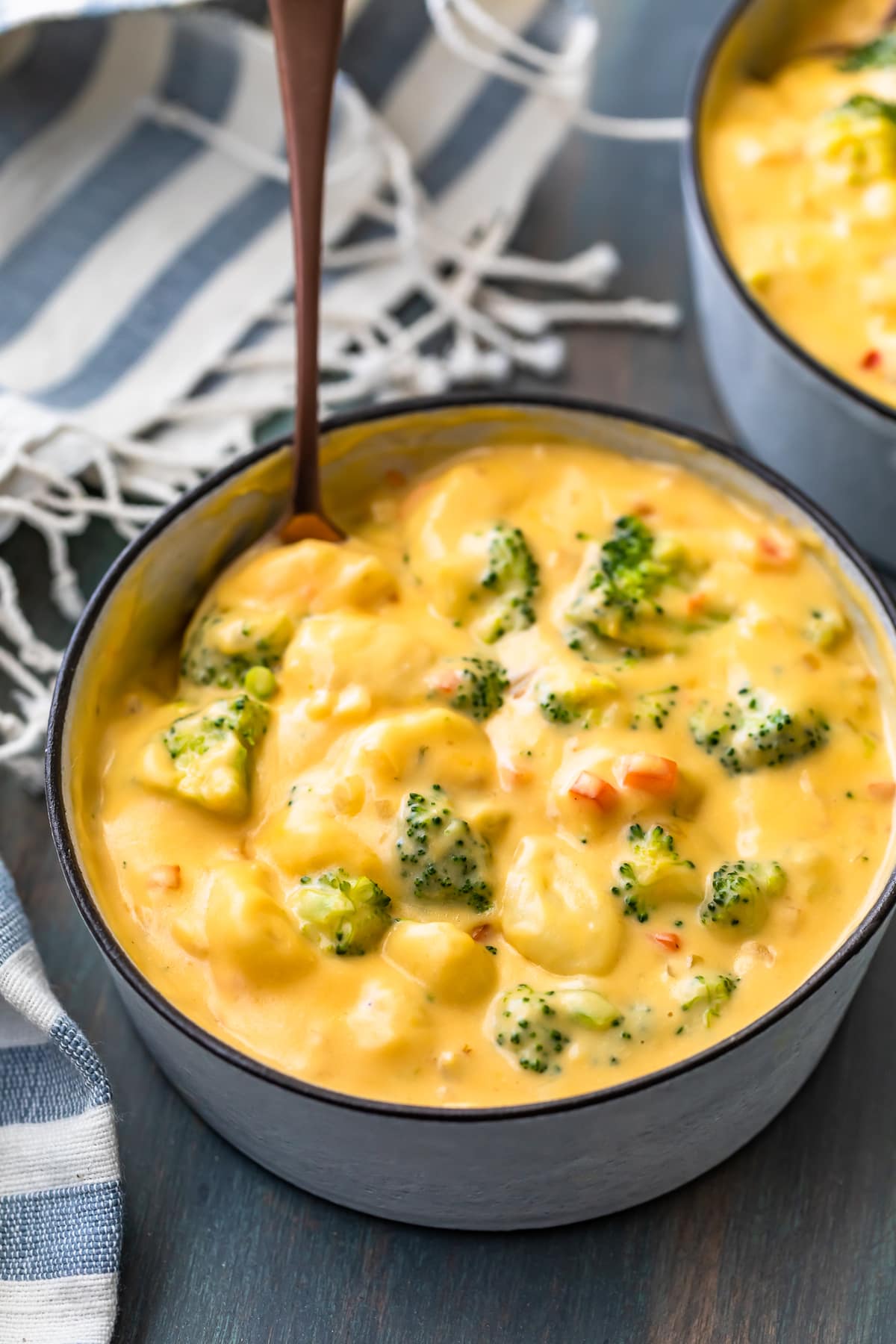 a bowl of broccoli cheddar soup with gnocchi