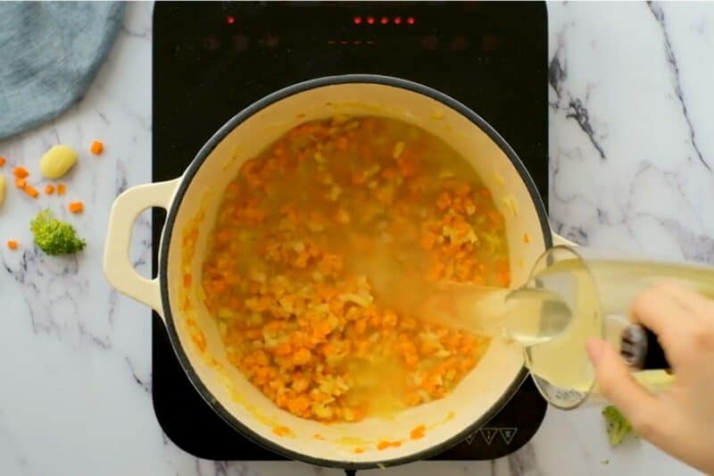 pour chicken stock gradually while deglazing the pan
