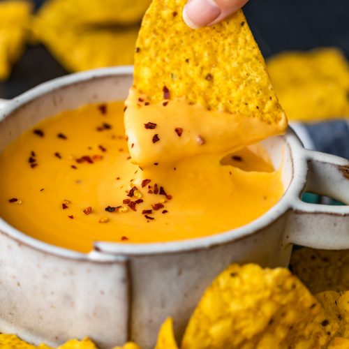 Nacho Cheese Sauce is something everyone should be able to make. An easy cheese dip (made in 5 minutes!) always comes in handy! This homemade nacho cheese sauce recipe is so delicious and so quick. Make it in a flash, dip in some chips, or use this versatile cheese sauce on all kinds of recipes!
