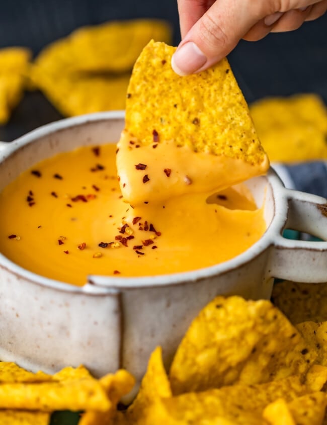 Nacho Cheese Sauce is something everyone should be able to make. An easy cheese dip (made in 5 minutes!) always comes in handy! This homemade nacho cheese sauce recipe is so delicious and so quick. Make it in a flash, dip in some chips, or use this versatile cheese sauce on all kinds of recipes!