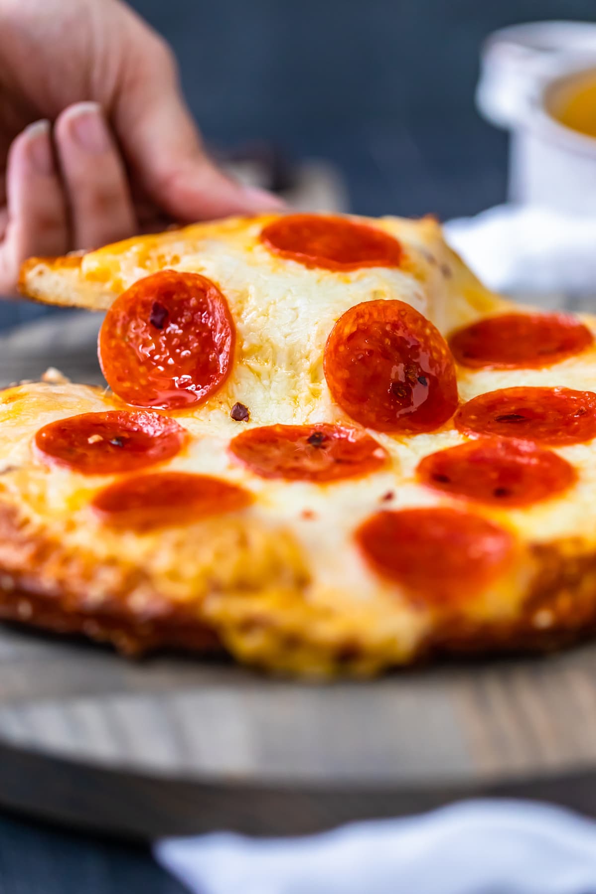 slice of soft pretzel crust pizza with pepperoni