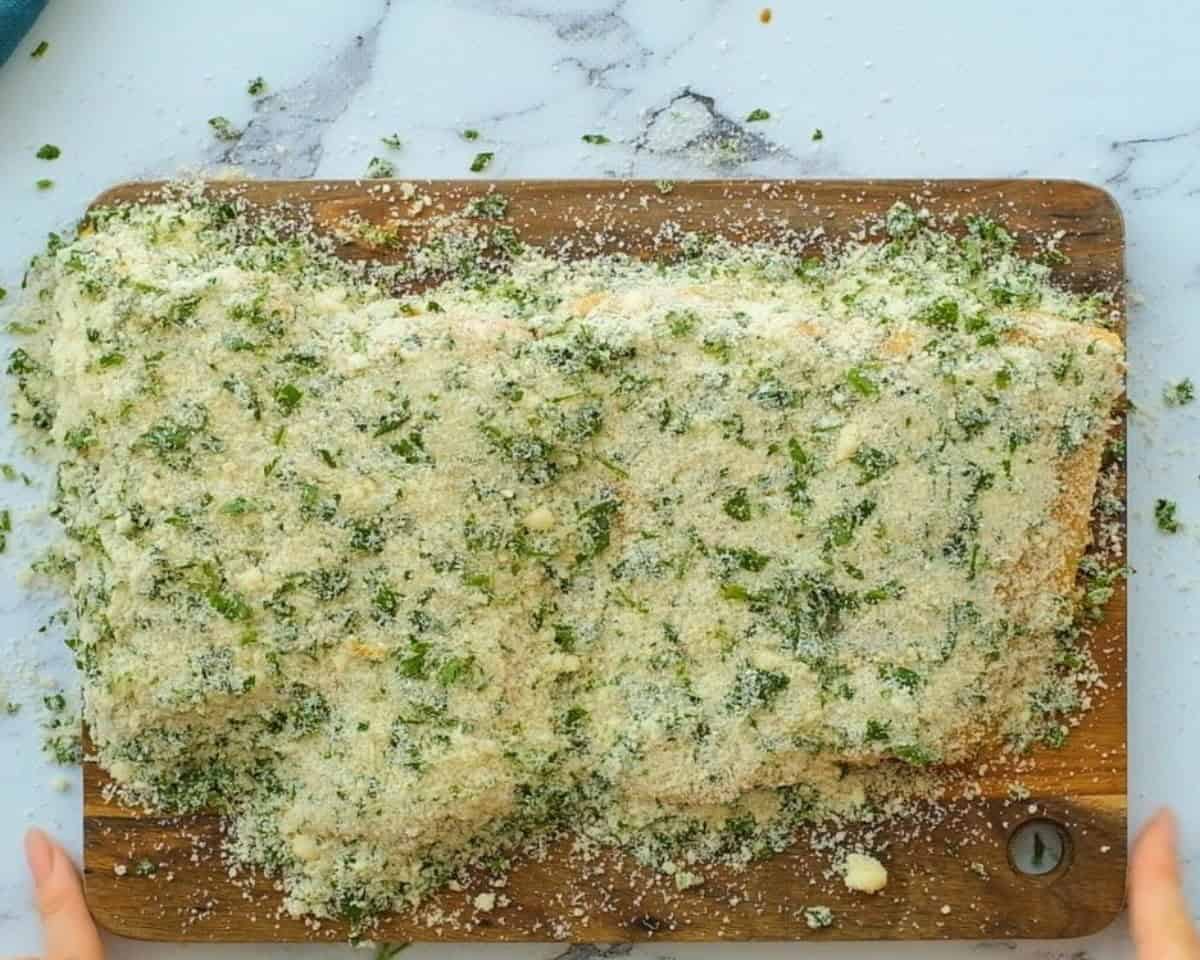 Salmon filets covered with the mustard spread and the panko crumbs.