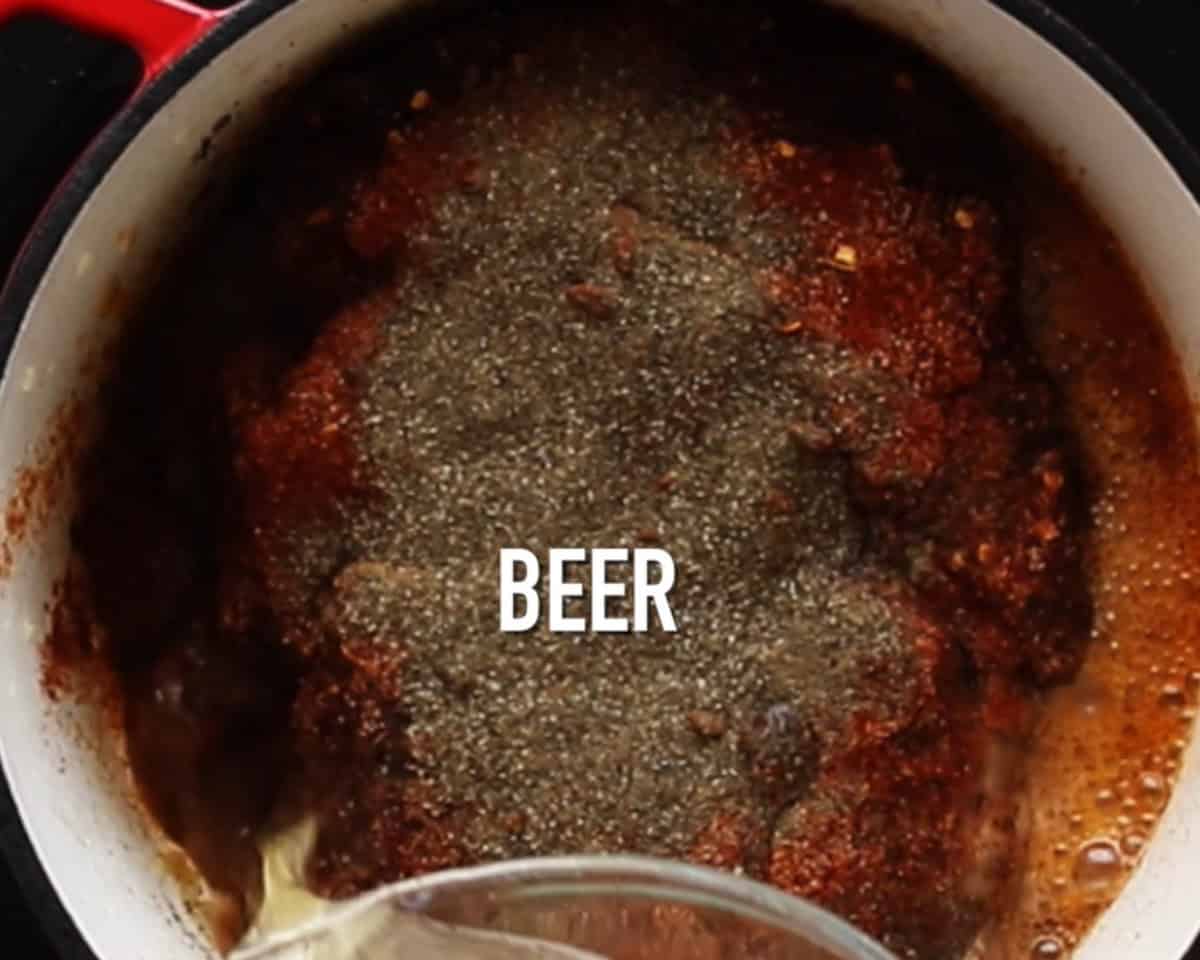 Cooking the beef with seasonings.