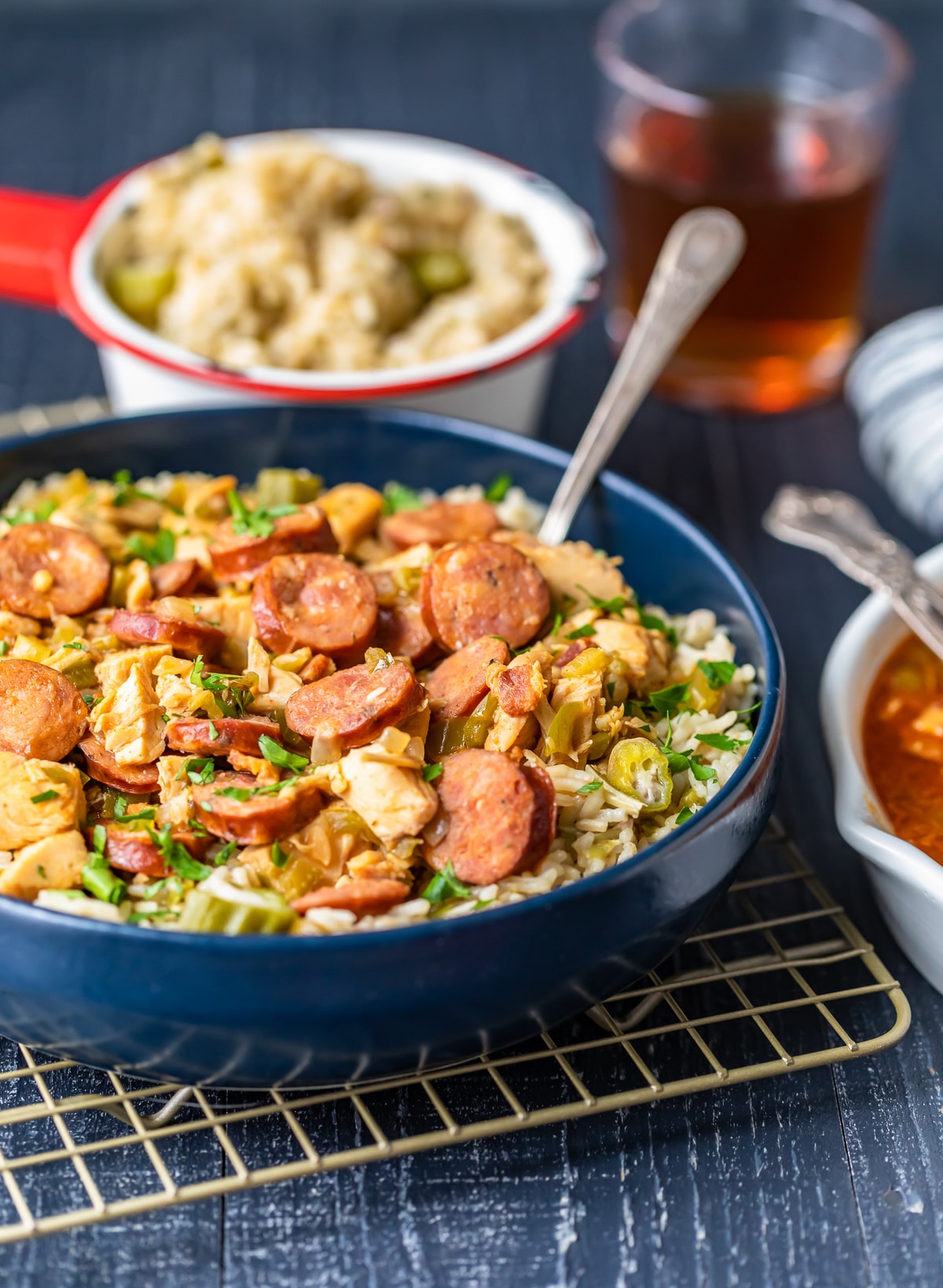 a large bowl of chicken and sausage gumbo over okra pilau rice