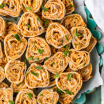 Mexican Pinwheels are a super simple and super tasty appetizer for any occasion. These Southwest Sausage Pinwheels are easy to make and require hardly any work at all. These sausage cream cheese pinwheels have all my favorite Mexican inspired flavor in one bite. Just as easy as any tortilla roll ups appetizer!