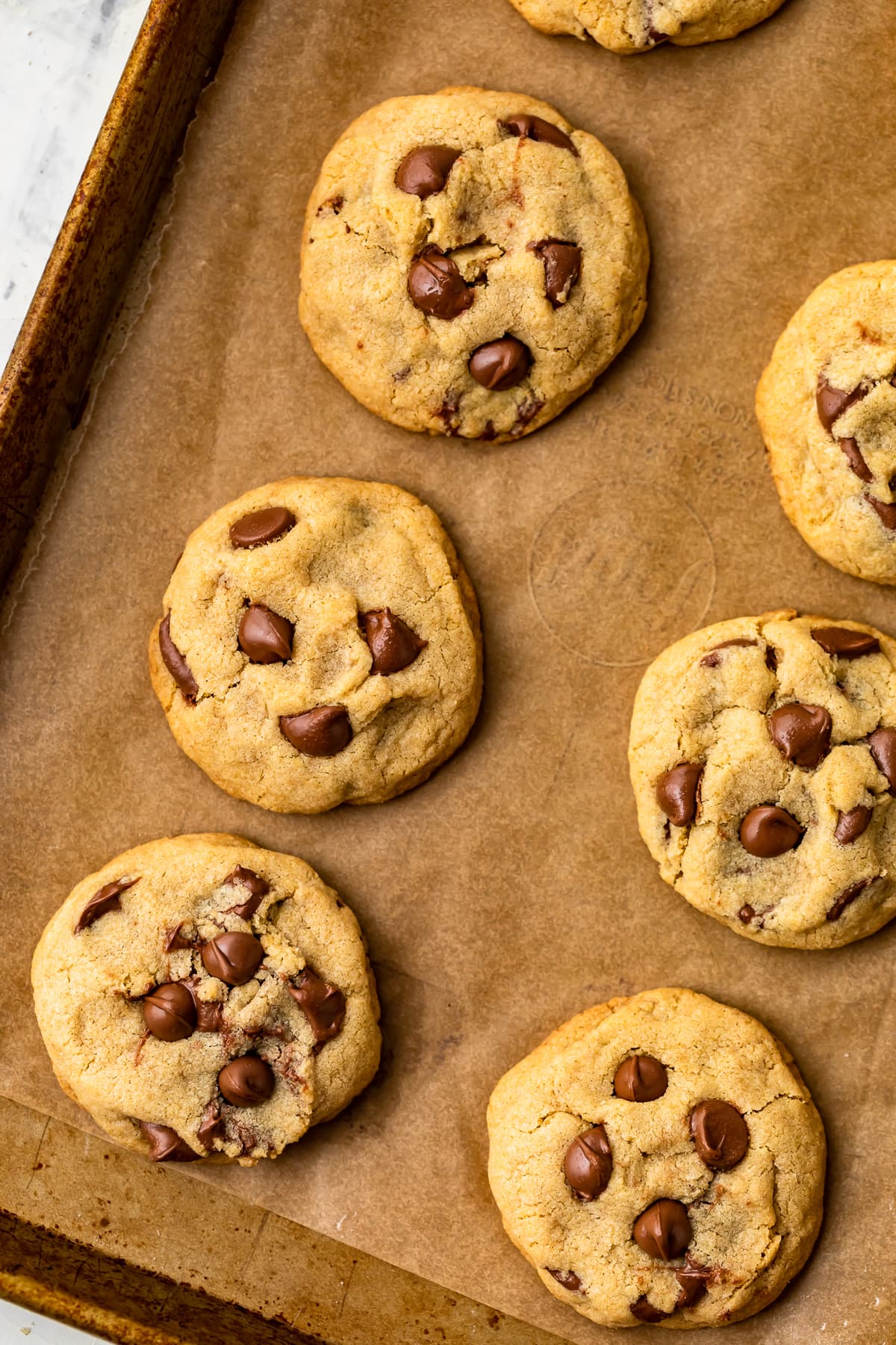 best soft chocolate chip cookies on a parchment lined baking tray