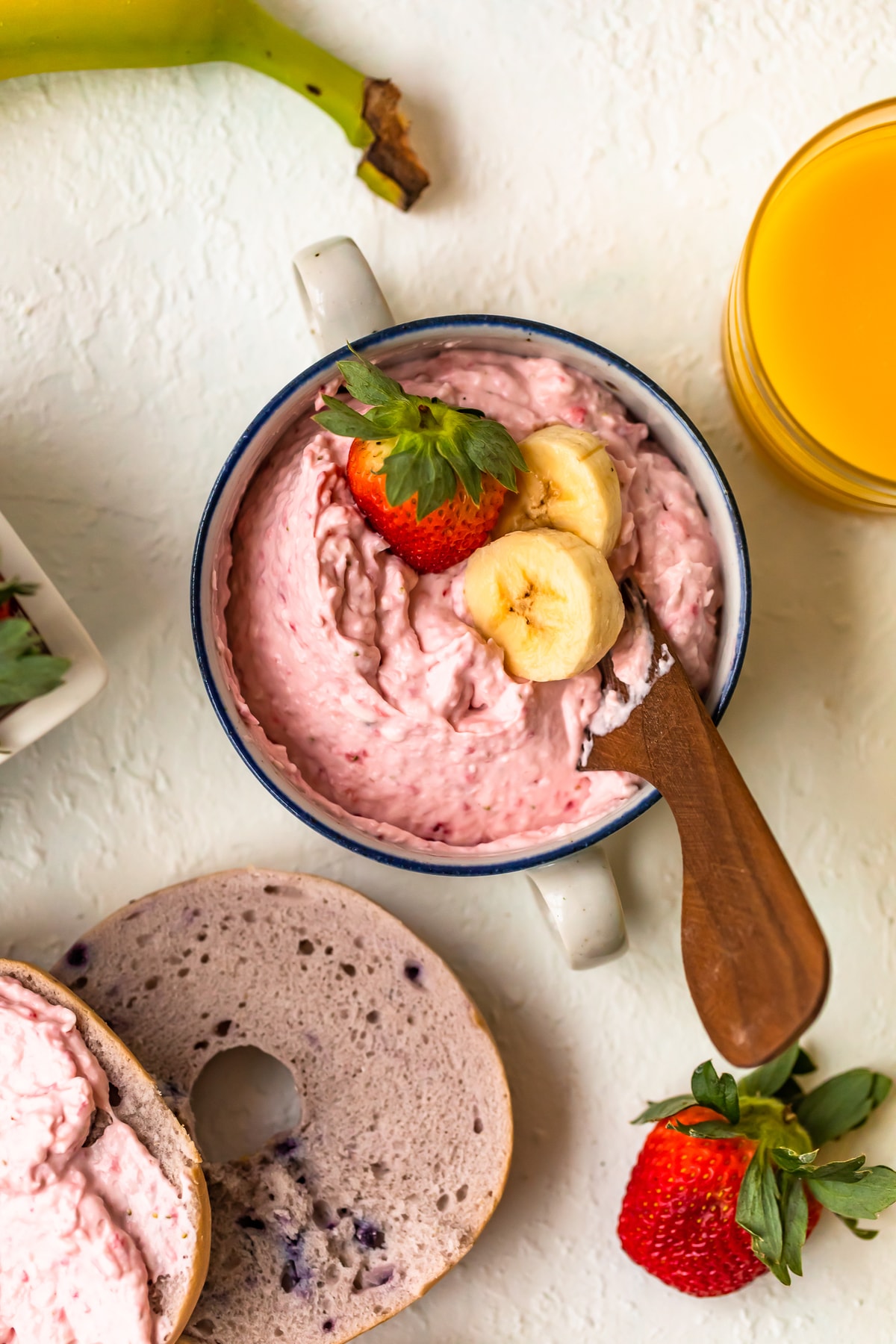 a dish filled with banana strawberry cream cheese spread