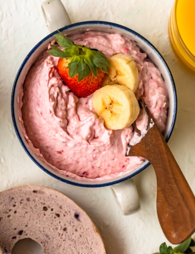Banana Strawberry Cream Cheese is the perfect way to add some fun to the typical bagel with cream cheese breakfast. This semi homemade cream cheese spread is so easy to make, and it adds to much flavor. Find out how to make this easy cream cheese recipe to add to your morning bagels!