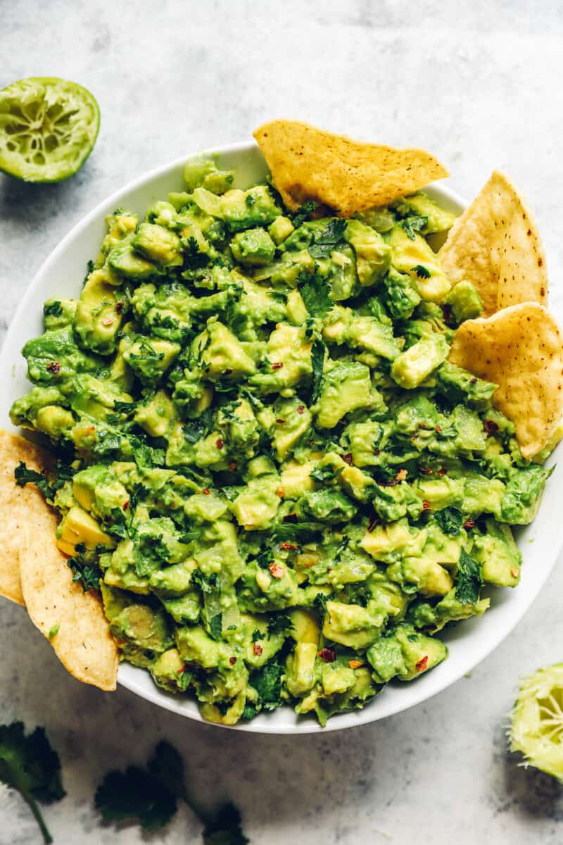 large white bowl filled with guacamole infused with tequila