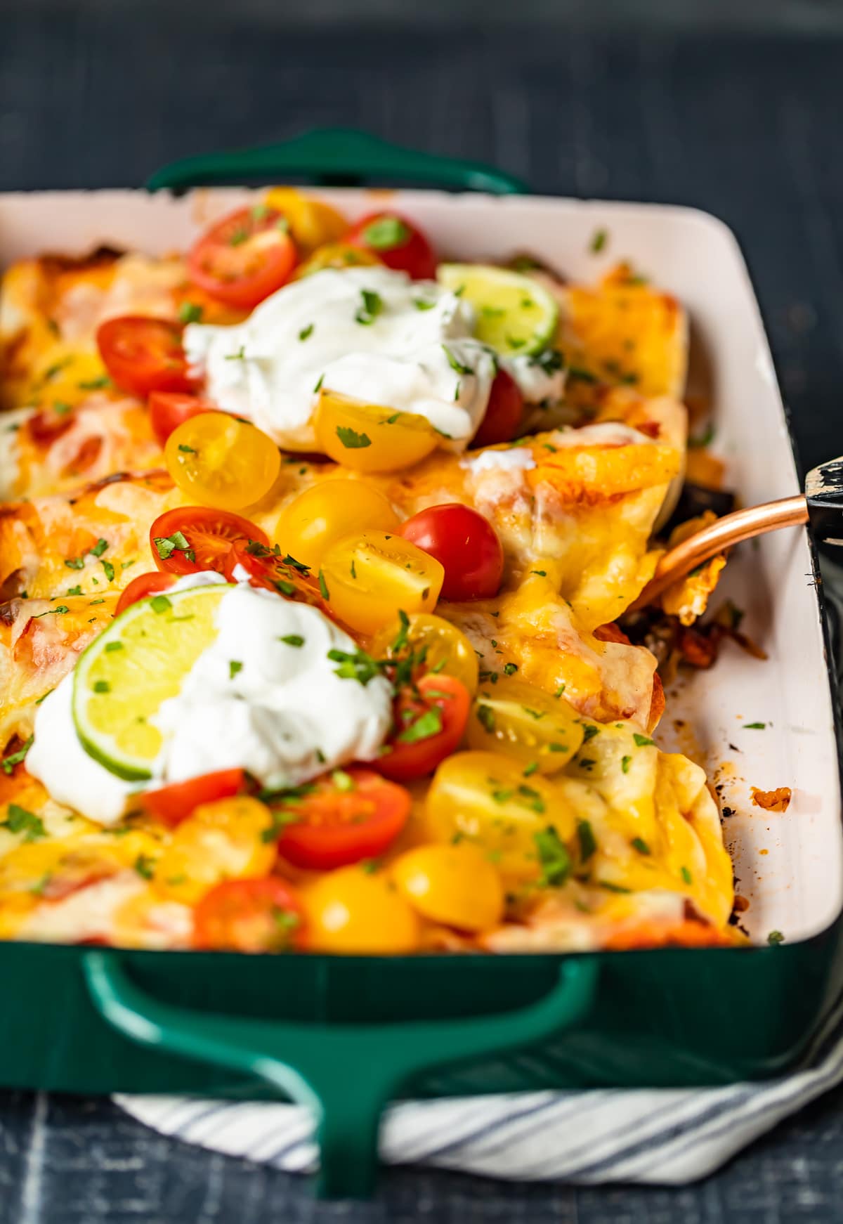 enchiladas made with shredded beef, onion, cheese, sour cream, picante sauce, and more