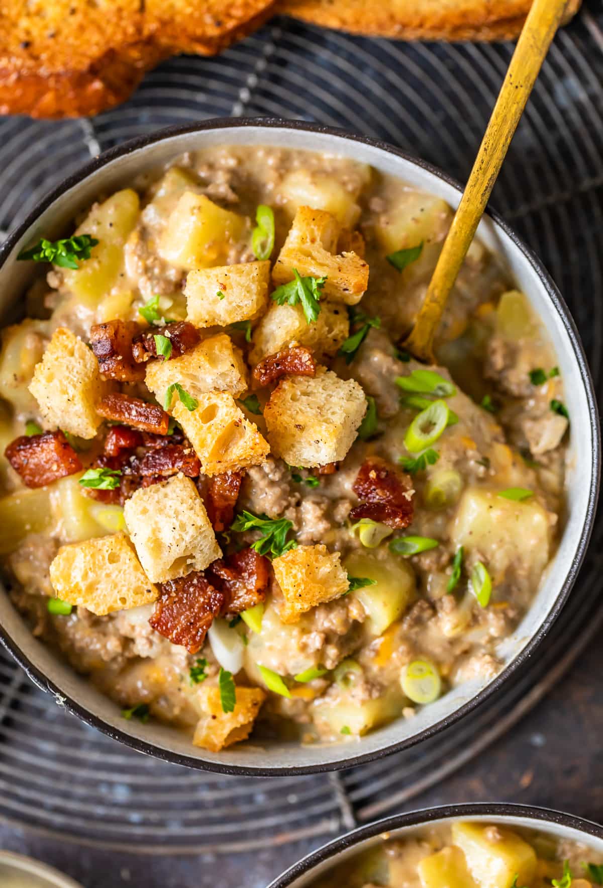 cheeseburger soup topped with bacon croutons