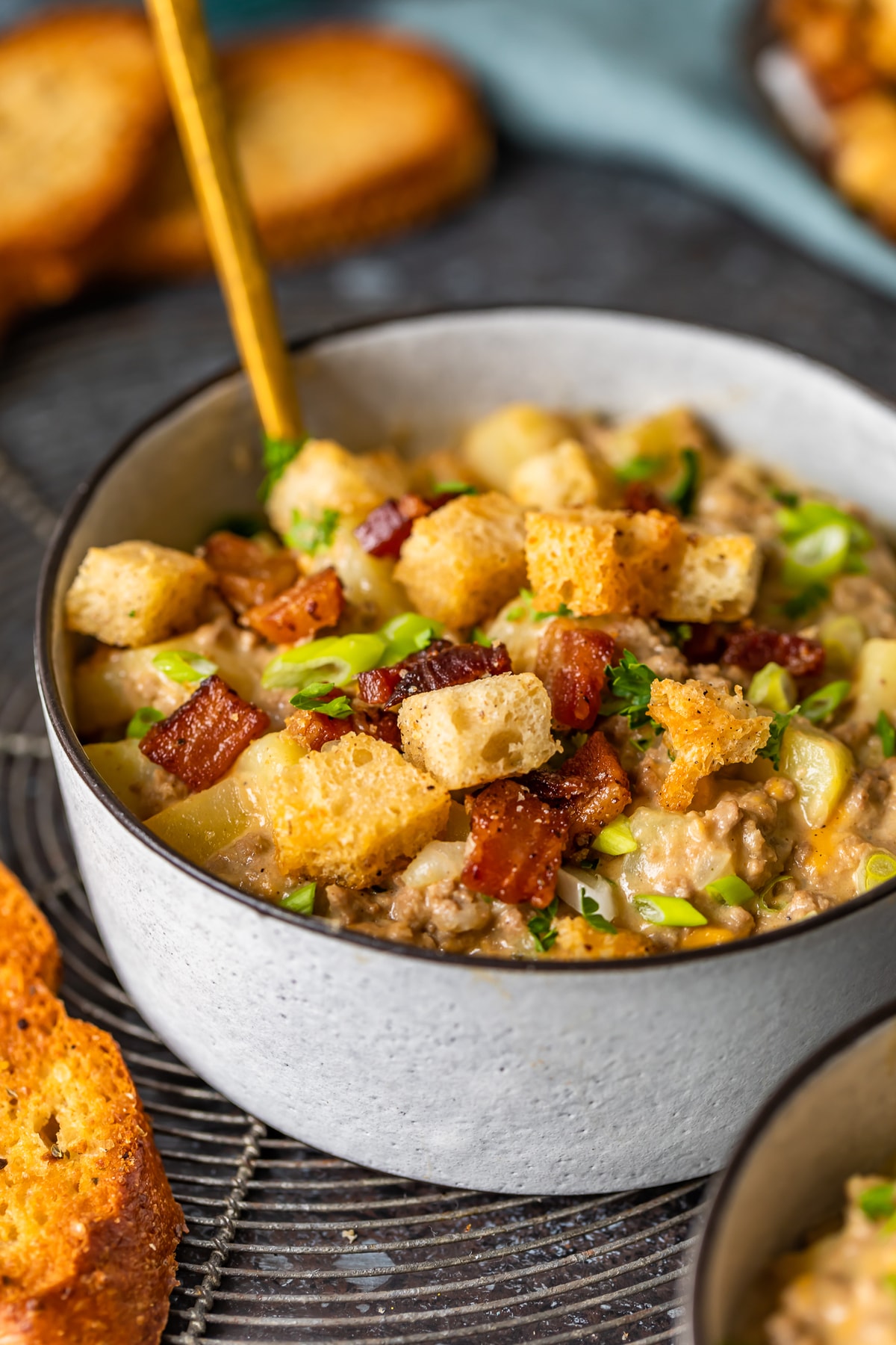 cheeseburger soup topped with bacon croutons