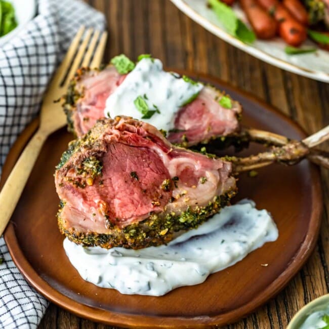 Rack of Lamb is an elegant option for holidays and special occasions. This delicious Herb Crusted Rack of Lamb recipe is simple yet filled with incredible flavor! The Mint Yogurt Sauce is the perfect compliment to the savoriness of this dish. Try this roast rack of lamb for a beautiful Easter Dinner!