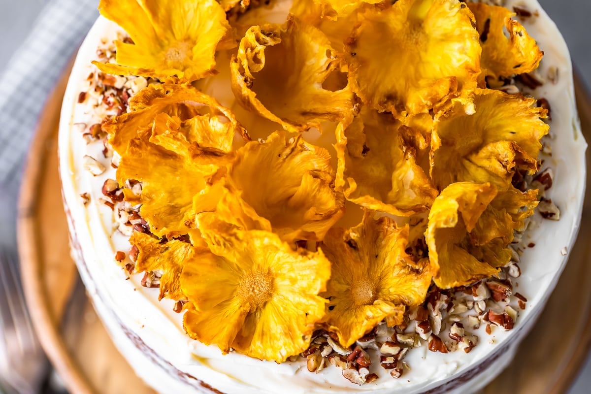 overhead view of hummingbird cake topped with dried pineapple flowers