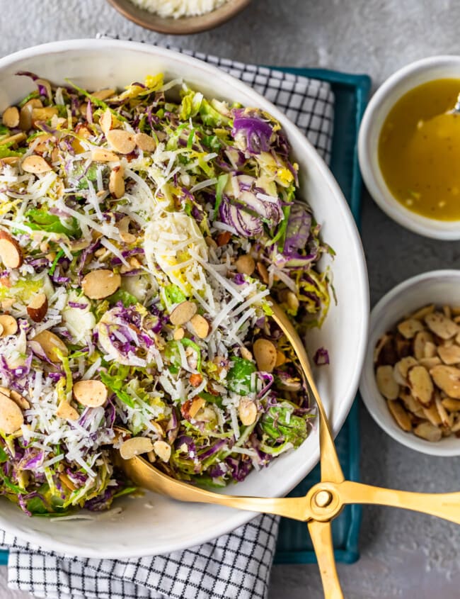 Shaved Brussels Sprout Salad is a simple side dish to serve with any meal. Brussels Sprouts, toasted almonds, and cheese are tossed with a Honey Lemon Dijon Vinaigrette for a light and delicious flavor. This shaved Brussels Sprouts recipe is so easy and can be made in no time!