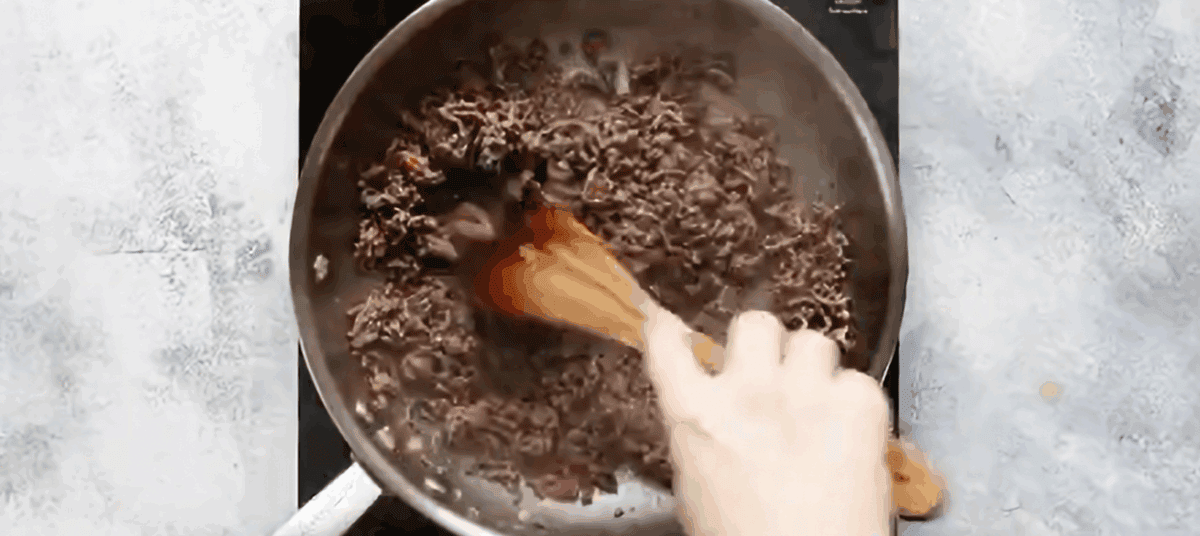 Cooking ground beef in a skillet.