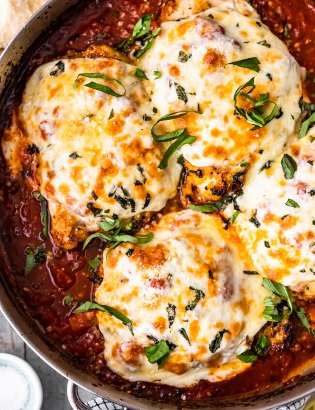 Chicken Parmesan is a classic dish that seems to be loved by all. This crispy chicken parm is the BEST Chicken Parmesan recipe ever. It's so easy and so delicious. Make it for an easy weeknight dinner, or a special occasion!