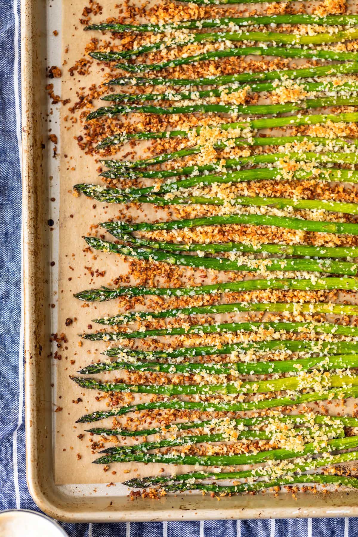 asparagus topped with garlic, parmesan, and breadcrumbs