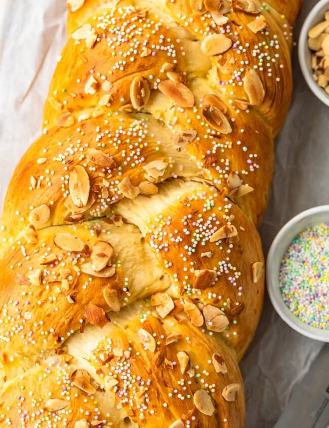 This Easter Bread recipe is so fun and festive! This simple sweet bread recipe is filled with flavor, and topped with sprinkles for a special treat. The Orange Almond flavor is perfect for Easter Sunday!