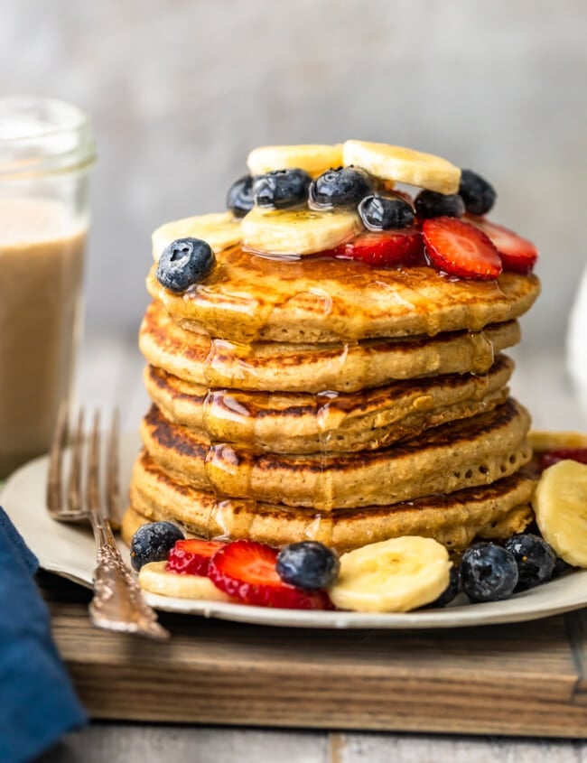 Banana Pancakes are a simple, tasty, healthy recipe you can make for breakfast every morning! These dairy free pancakes are made with almond milk, bananas, oats, and lots of other good stuff. Healthy pancakes for a delicious breakfast! You're going to LOVE this easy banana pancake recipe.