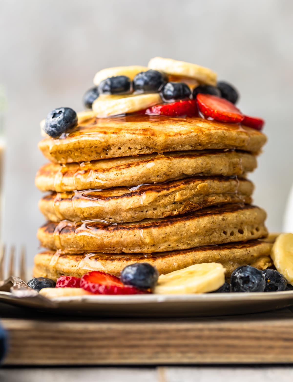 up close shot of easy banana pancakes stacked on a plate