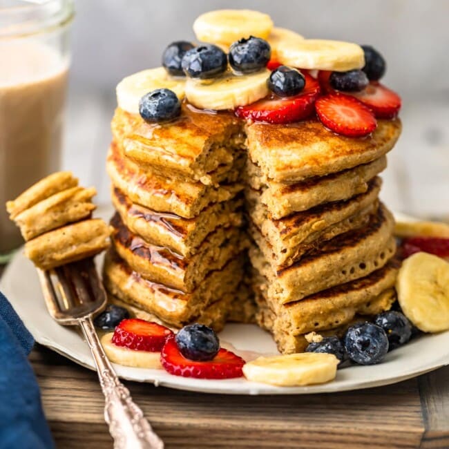 Banana Pancakes are a simple, tasty, healthy recipe you can make for breakfast every morning! These dairy free pancakes are made with almond milk, bananas, oats, and lots of other good stuff. Healthy pancakes for a delicious breakfast! You're going to LOVE this easy banana pancake recipe.