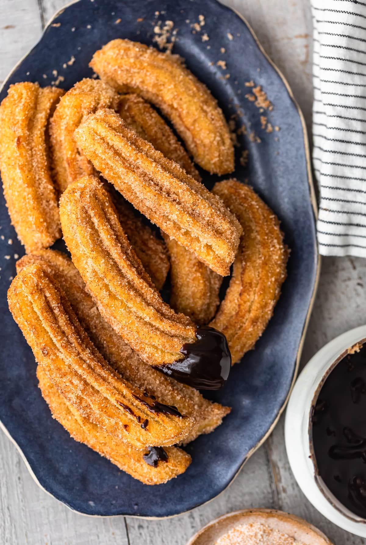 easy churros dipped in homemade chocolate sauce