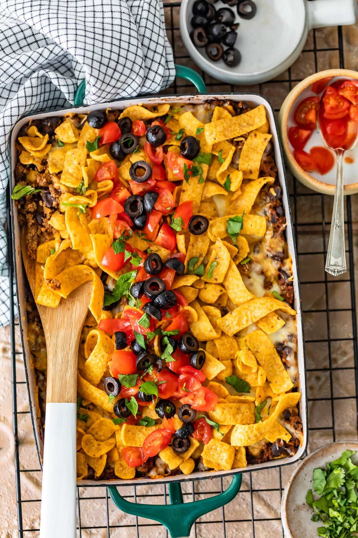 fritos, beef, cheese, olives, tomatoes, onions layered into a casserole dish