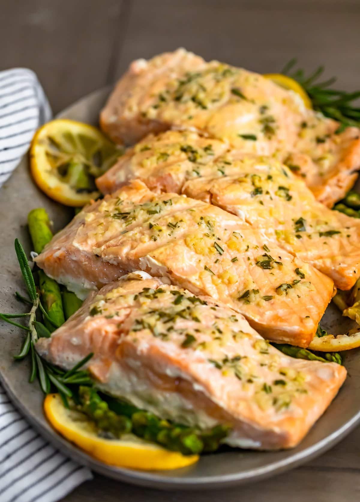 a plate of garlic butter salmon with grilled asparagus