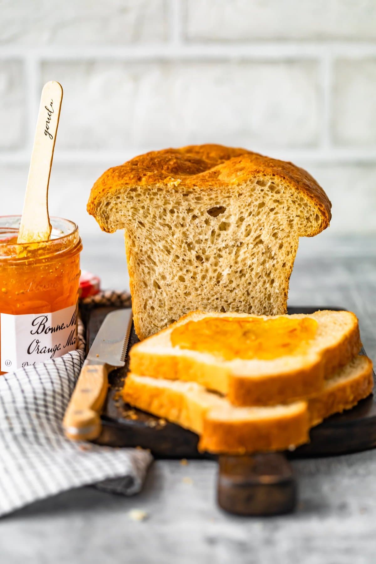 sandwich bread next to a jar of marmalade 