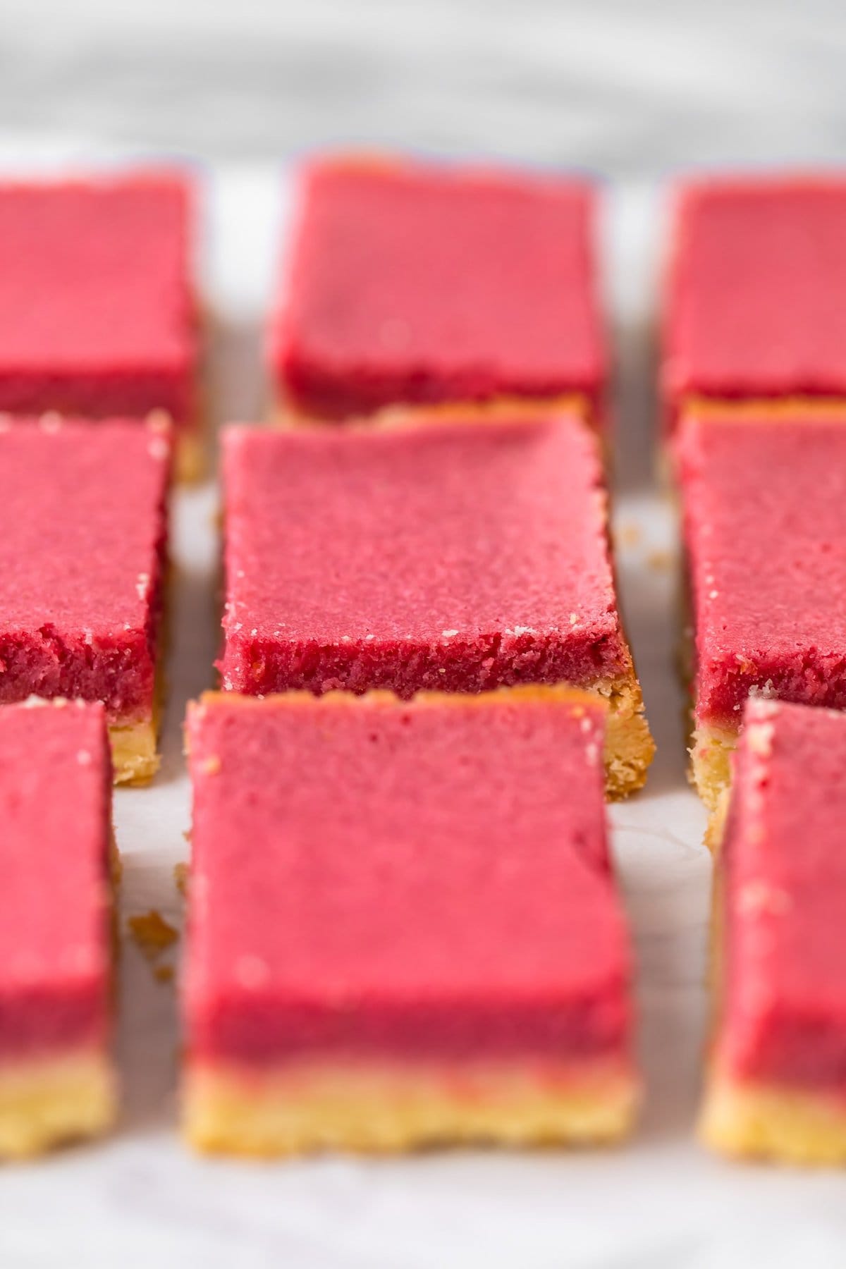 raspberry lemon bars sliced into squares