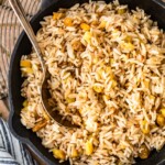 A bowl of food, with Pilaf and Spice